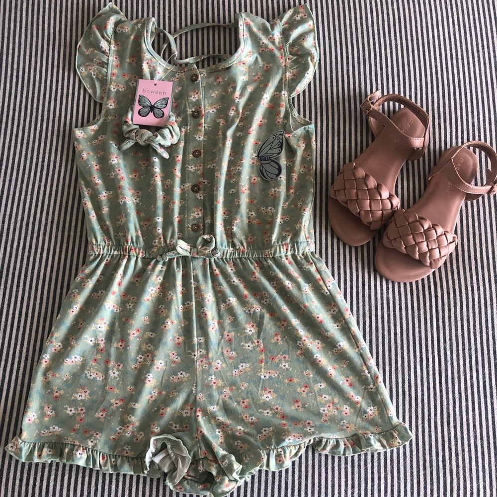 New Girl’s Romper with matching hair tie included. Size 12